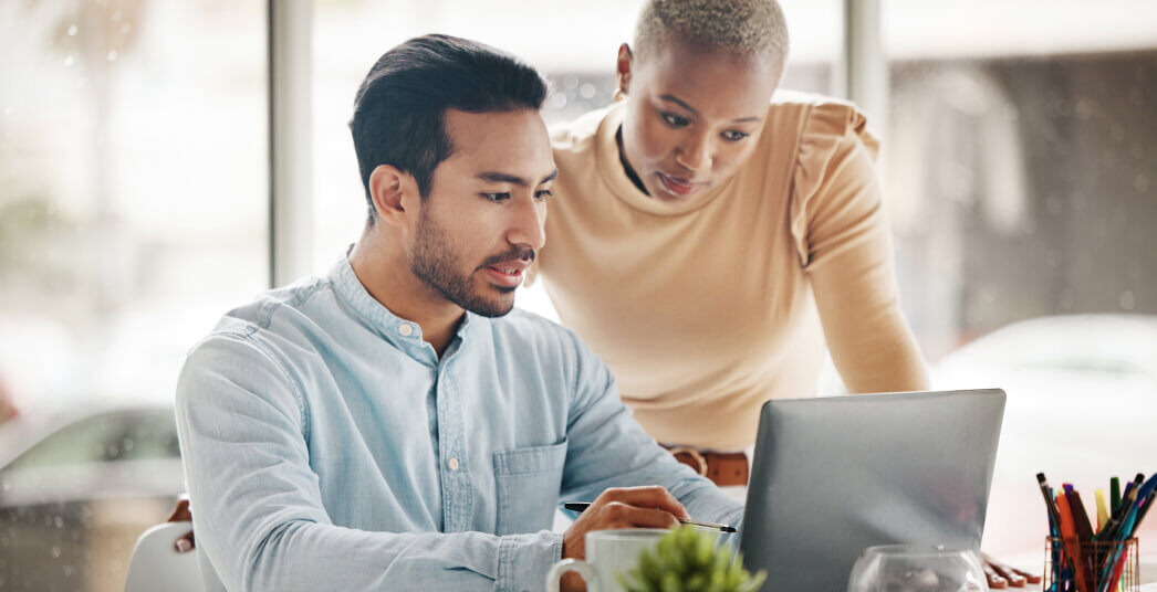 two people working on a laptop together